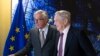EU commission President Jean-Claude Juncker, left, welcomes George Soros, Founder and Chairman of the Open Society Foundation, prior to a meeting at EU headquarters in Brussels on Thursday, April 27, 2017.