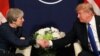 U.S. President Donald Trump shake hands with Britain's Prime Minister Theresa May during the World Economic Forum (WEF) annual meeting in Davos, Switzerland, Jan. 25, 2018.