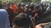 Security forces and police pushed the monks from behind when the monks are making their way on Duong Ngeab 2 road in the morning of Sunday January 3rd,2016. (Hul Reaksmey/VOA Khmer)