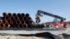 FILE - Pipes are piled up at a storage area at French pipe coating company EUPEC in Sassnitz, May 6, 2011. EUPEC is working to complete around 200,000 pipes for Nord Stream, which is building two 1,220 km-long roughly parallel gas pipelines across the Baltic Sea from Russia to Germany with an overall annual capacity of 55 billion cubic meters.