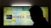 A man passes by a map of the Korean peninsula at the Unification Observation Post near the demilitarized zone between the two Koreas in Paju, north of Seoul, South Korea, March 28, 2013.