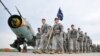 U.S. paratroopers after being flown into the air base in Swidwin, Poland for weeks of joint military exercises, April 23, 2014.