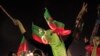A supporter of the chairman of the Pakistan Tehreek-e-Insaf political party Imran Khan, a former international cricketer, cheers while listening to him speak during what has been dubbed a "freedom march" in Islamabad, August 28, 2014.