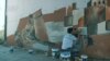 Mosul Artist Paints Over IS Graffiti With Murals of City's Old Glory