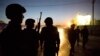 FILE - Afghan police arrive to secure the area after a car bomb detonated outside an ISAF civilian personnel compound in Kabul, Afghanistan.