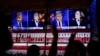 Viewers cheer as they watch a debate between Democratic presidential nominee Vice President Kamala Harris and Republican presidential nominee former President Donald Trump at the Angry Elephant Bar and Grill, Sept. 10, 2024, in San Antonio.