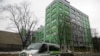 FILE - In this file photo taken Oct. 27, 2017, a car of Russian state-owned television station RT passes by the company's office in Moscow. 