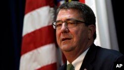 FILE - U.S. Deputy Secretary of Defense Ashton Carter answers reporter's question during a news conference at the U.S. Embassy in Seoul, South Korea, March 18, 2013.