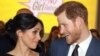 FILE - Britain's Prince Harry, left and Meghan Markle attend a women's empowerment reception at the Royal Aeronautical Society, during the Commonwealth Heads of Government Meeting, in London, April 19, 2018. 