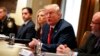 El presidente Donald Trump escucha durante una reunión con agentes del orden público sobre la pandilla callejera MS-13 y la seguridad fronteriza, en la sala del gabinete de la Casa Blanca, el martes 6 de febrero de 2018 en Washington. 