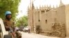 FILE - A peacekeeper with the United Nations patrols outside the mosque in Mopti, central Mali, May 30, 2018.