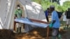 FILE - Doctors Without Borders (MSF) staff set up a cholera treatment field camp in Longo, 15 km from Bangui, Central African Republic, Aug. 16, 2016. 