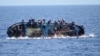 This handout picture released on May 25, 2016 by the Italian Navy (Marina Militare) shows the shipwreck of an overcrowded boat of migrants off the Libyan coast today. 