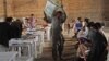 Afghan election commission worker unloads ballot boxes in Herat Province, west of Kabul, April 20, 2014.