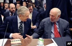 Soros Fund Management chairman George Soros, left, shakes hands with Renaissance Technologies President James Simons on Capitol Hill in Washington, Thursday, Nov. 13, 2008, prior to testifying before the House Oversight and Government Reform Committee hearing on "Hedge Funds and the Financial Market".