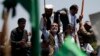 Afghan presidential candidate Abdullah Abdullah (C) attends a protest in Kabul, June 27, 2014.