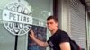 Peter Garratt, one of the sons of Canadian couple Kevin and Julia Dawn Garratt, who are being investigated in China for threatening national security, stands outside his parents' coffee shop as he talks to Reuters journalists in Dandong, Liaoning province