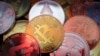 FILE - Representations of cryptocurrencies are seen in this illustration picture taken June 2, 2021. 