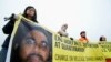 Wasu Masu Fafutukar Kare Hakkin Bil Adama Rike Da Hoton Shaker Aamer. 