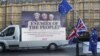 Anti-Brexit protesters demonstrate outside the Houses of Parliament in London, Britain, Dec. 13, 2017.