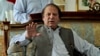 Former prime minister and leader of Pakistan Muslim League-N party, Nawaz Sharif, gestures while speaking to members of the media at his residence in Lahore, Pakistan, May 13, 2013.