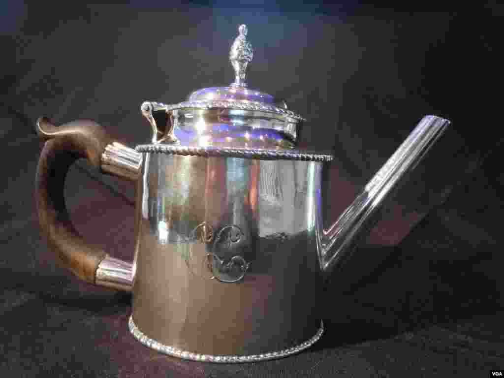 A silver teapot, made by American patriot and silversmith Paul Revere in 1780, is expected to sell for up to $250,000. (VOA/J. Taboh) 