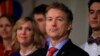 FILE - Republican presidential candidate, Sen. Rand Paul, R-Ky, stands with his wife, Kelley, as he waits to speaks to supporters during a caucus night party at the Scottish Rite Consistory in Des Moines, Iowa, Feb. 1, 2016.