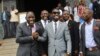 FILE - Ugandan pop star Kyagulanyi Ssentamu, better known as Bobi Wine, center, leaves shortly after being sworn in as a member of parliament in Kampala, Uganda, July 11, 2017.