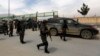 Afghan police secure the area outside Cure Hospital after three Americans were killed, Kabul, April 24, 2014. 