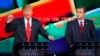 FILE - Republican U.S. presidential candidate businessman Donald Trump (L) speaks as Senator Ted Cruz looks on during the Republican presidential debate in Las Vegas, Nevada, Dec. 15, 2015. 