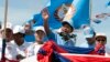 In this Friday, June 2, 2017, file photo, Cambodian Prime Minister Hun Sen, center, of the Cambodian People's Party (CPP), waves from a truck as he leads a rally in Phnom Penh, Cambodia, during the last day of campaigning ahead of the June 4 communal elections. (AP Photo/Heng Sinith)