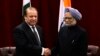 FILE - Pakistan's Prime Minister Nawaz Sharif (L) shakes hands with India's Prime Minister Manmohan Singh during the United Nations General Assembly in New York.