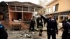Policemen secure the site of a bomb attack at the district court in Islamabad, March 3, 2014. 