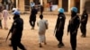 UN peacekeepers from Rwanda secure a polling station during vote counting in Bangui, Central African Republic, Sunday Feb. 14, 2016. Two former prime ministers, Faustin Archange Touadera and Anicet Georges Dologuele, are running neck-and-neck in the second round of presidential elections to end years of violence pitting Muslims against Christians in the Central African Republic. Central Africans will also vote in legislative elections. (AP Photo/Jerome Delay)