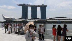 စင်္ကာပူ နိင်ငံရဲ့ Merlion Park တနေရာ (ဓာတ်ပုံ- Roslan RAHMAN / AFP)