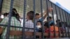 Suspected Uighurs are transported back to a detention facility in the town of Songkhla in southern Thailand after visiting women and children at a separate shelter, March 26, 2014.