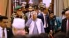 FILE PHOTO: Nobel laureate Muhammad Yunus salutes to the attendees upon arrival at the Bangabhaban to take oath as the head of the interim government