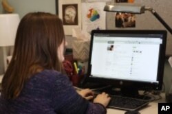 ResearchGate fan Caroline Moore-Kochlacs logs onto the website at her Boston University office.