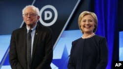FILE - Democratic presidential candidates, Hillary Clinton and Sen. Bernie Sanders, I-Vt, stand together before the start of the Univision, Washington Post Democratic presidential debate at Miami-Dade College, March 9, 2016.
