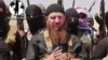 FILE - Islamic State commander Omar al-Shishani (C), aka Omar the Chechen, is seen in an image made from undated video posted June 28, 2014, on a social media account frequently used for communications by the jihadist group.
