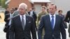 Malaysian Prime Minister Najib Razak, left, walks along the tarmac with Australian Prime Minister Tony Abbott on their way to meet crew members involved in search of wreckage and debris of the missing Malaysia Airlines MH370 in Perth, Australia, Thursday,