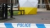 A police tent covers the spot in Salisbury, Britain, March 6, 2018, where former Russian double agent Sergei Skripal and his daughter Yulia were found critically ill Sunday following a suspected exposure to an "unknown substance."