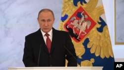 Shugaban Rasha Putin yayinda yake jawainsa na shekara shekara jiya.
