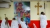 FILE - Eritrean Christian Orthodox migrants attend a mass at a makeshift church in Tel Aviv, Israel, May 7, 2016. 