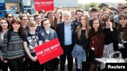 Jeremy Corbyn, the leader of Britain's opposition Labour Party, poses for a picture with first time voters at a campaign event in Garfoth, Leeds, May 10, 2017.
