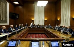 Asaad Al-Zoubi (R), head of the Syrian opposition delegation, and Salim al-Muslat (2nd R), spokesman for the High Negotiations Committee (HNC), attend peace talks with U.N. mediator for Syria Staffan de Mistura (2nd L) at the United Nations in Geneva, Switzerland, Feb. 1, 2016.