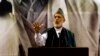 Afghan President Hamid Karzai, center, speaks during a ceremony honoring the late Commander Ahmad Shah Massoud, a beloved anti-Taliban fighter who was assassinated 13 years ago, in Kabul, Afghanistan, Sept. 9, 2014. 