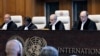 Judge and President of the International Court of Justice (ICJ), Nawaf Salam (2nd R) delivers a non-binding ruling on the legal consequences of the Israeli occupation of the West Bank and East Jerusalem at the International Court of Justice (ICJ) in The H