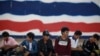 Cambodian migrant workers wait for document process as they prepare to migrate back to Cambodia at the Aranyaprathet Police station in Sa Kaew, Thailand, June 15, 2014.