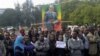 A woman joins others as they wait for the remains of Ethiopia's Prime Minister Meles Zenawi to arrive in Ethiopia's capital Addis Ababa, August 21, 2012.